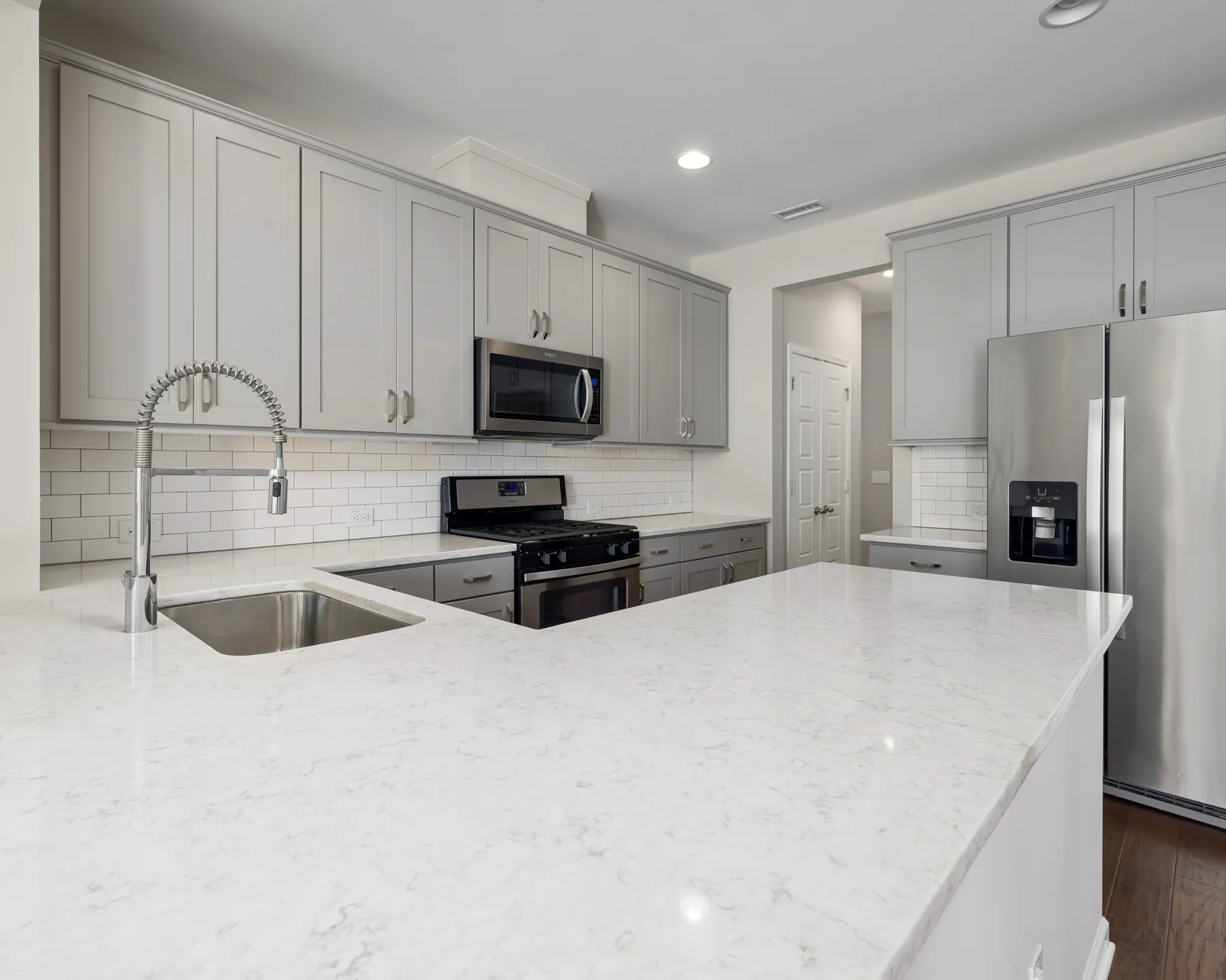 Placeholder after image of a bright white kitchen island countertop.