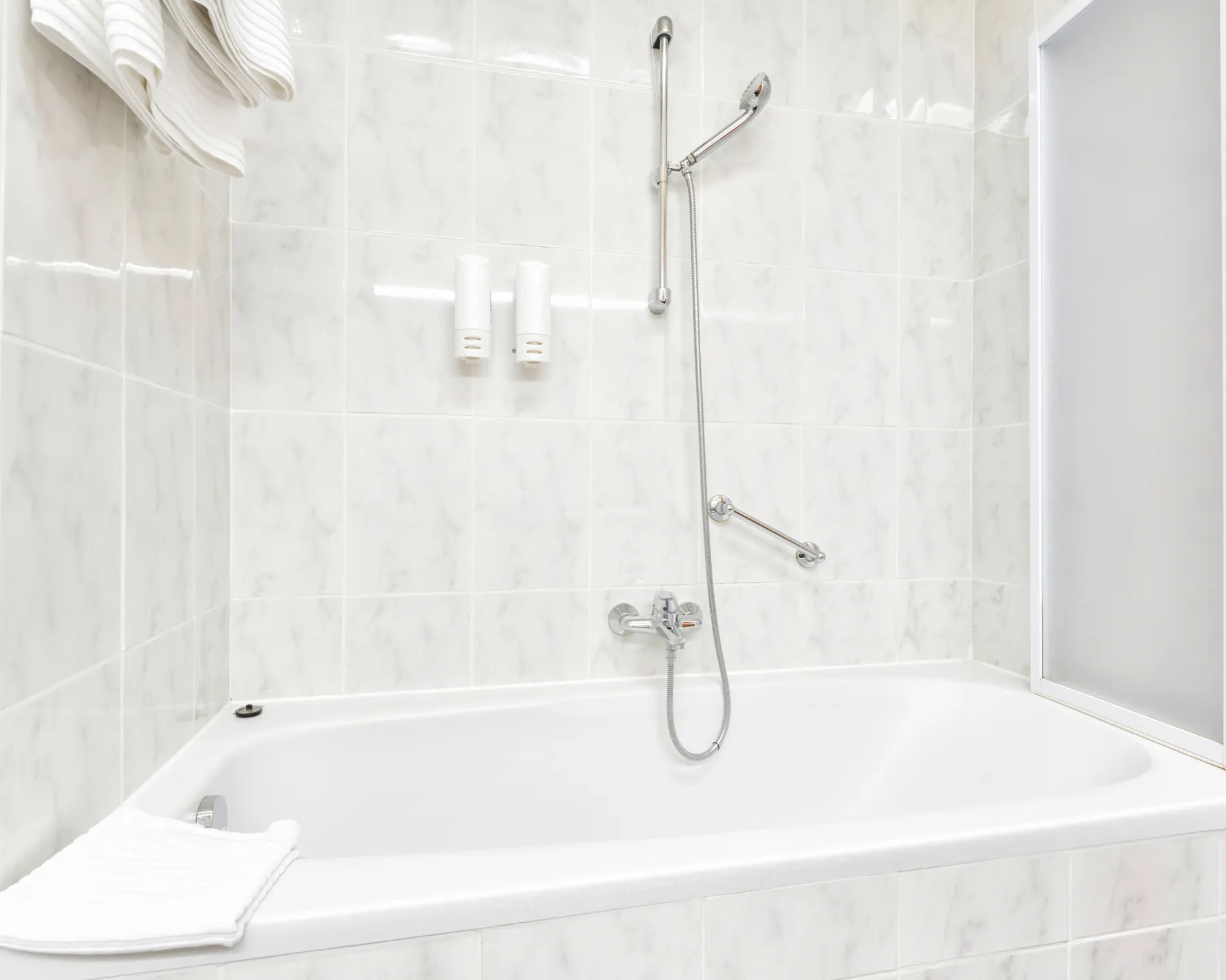 Placeholder after image showing a finished white tub and surrounding tile.